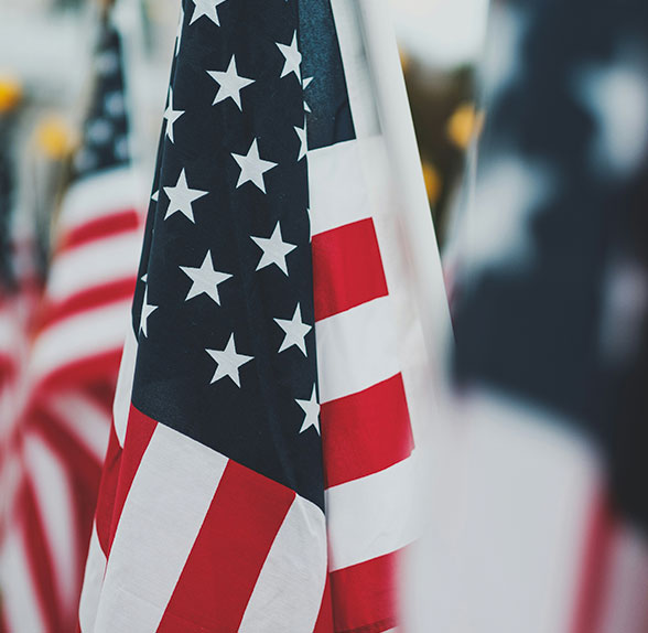Close-up of an American flag with stars and stripes.